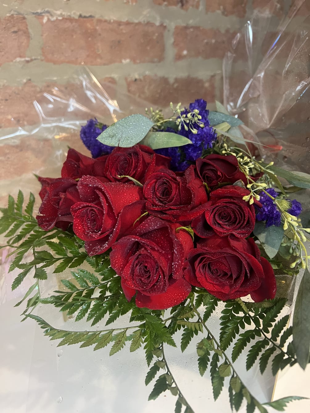 Indulge in the vibrant beauty of our 1 Dozen Red Rose Bouquet