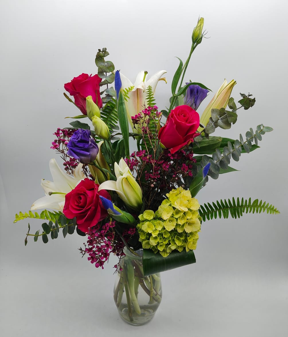 Lilies and iris with pink roses. Perfect for that someone special 