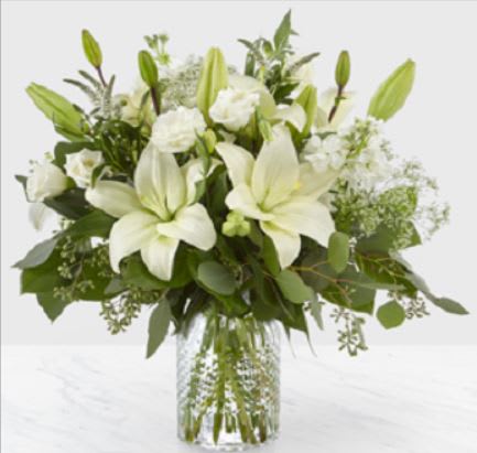 An illuminating array of all white florals brings an air of elegance