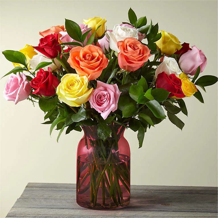 18 Assorted Colorful Blooming Roses 
Red Glass Vase
Place your Order Online Monday