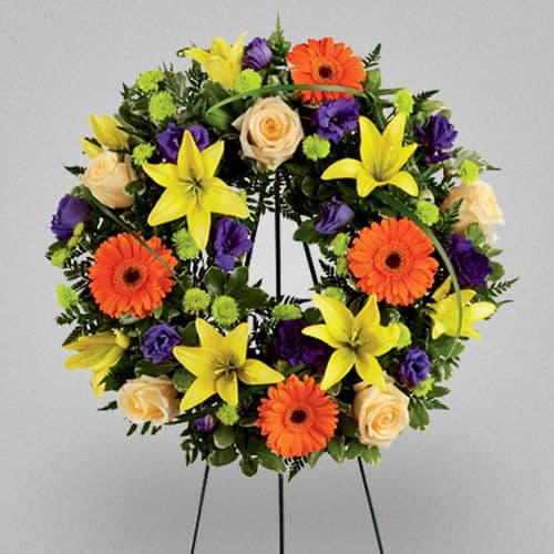 This wreath arrangement picks a lush and brilliant burst of color, which