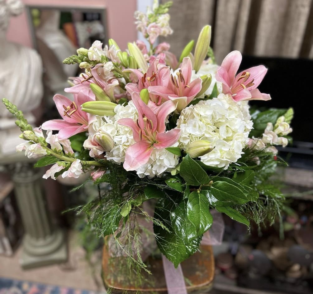 Soft tones of Pink Lillies with White Hydrangeas and Green arranged in