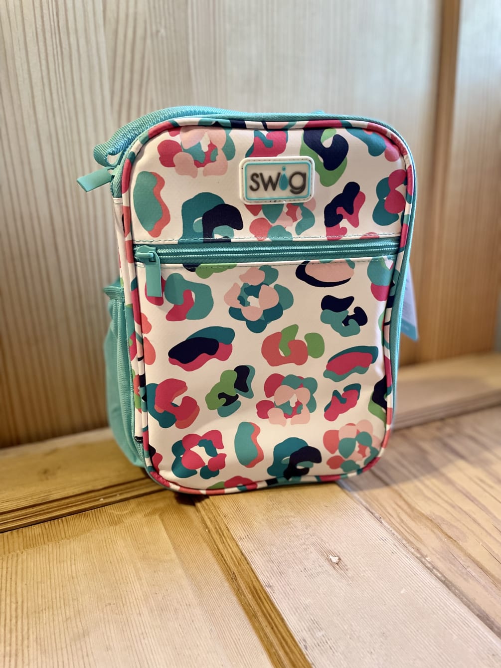 Lunch box includes removable insert with adjustable divider. Zip &amp; flip front