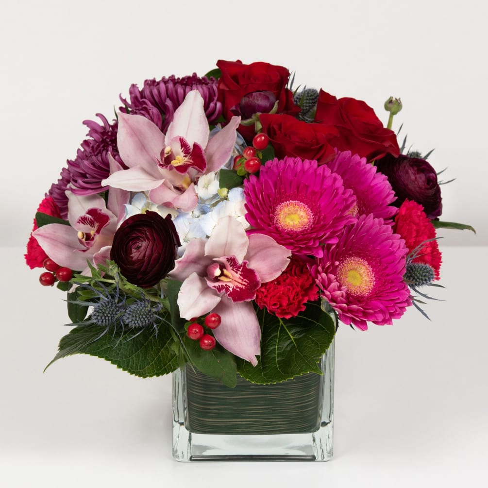 Roses and orchids make for a dazzling jeweled bouquet that will win