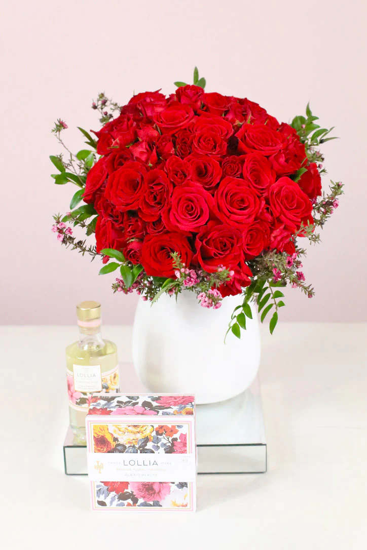 Bursting with love and beauty, this chic floral arrangement captivates with classic