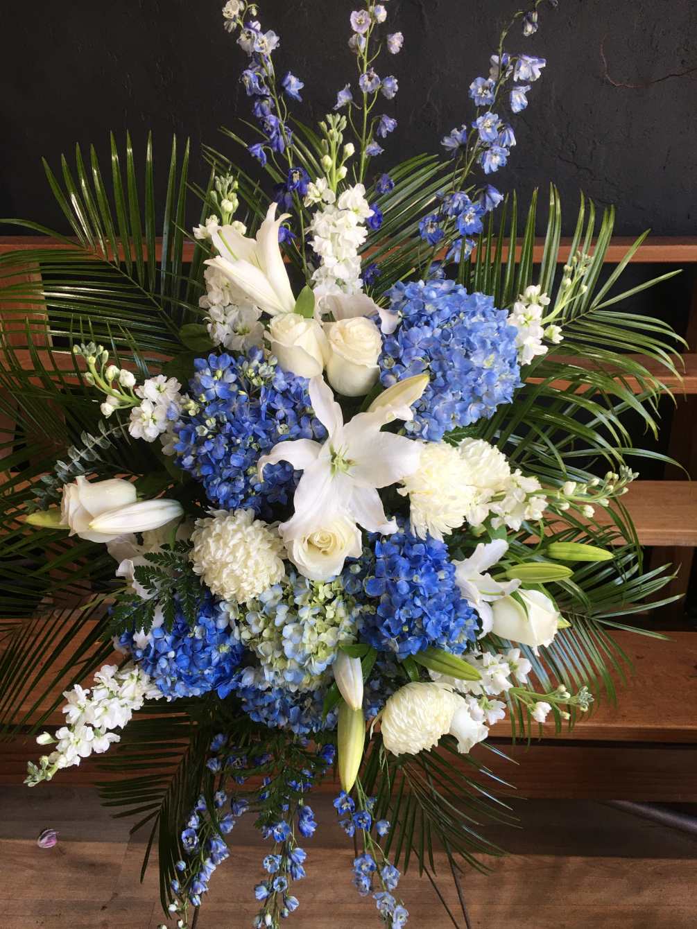 A standing spray of hydrangea, roses, lilies, dianthus, mums and ferns,

SUBSITUTION POLICY
In