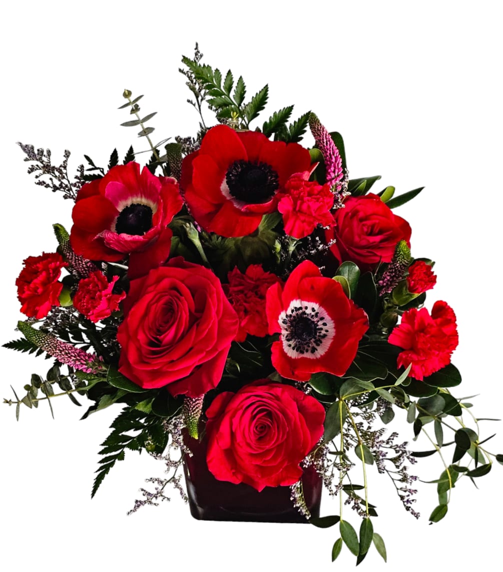 Ignite the flames of desire with Passion, a captivating floral bouquet that