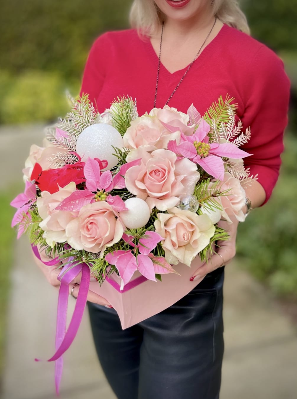 Nestled in a captivating heart-shaped box, this enchanting arrangement is a perfect