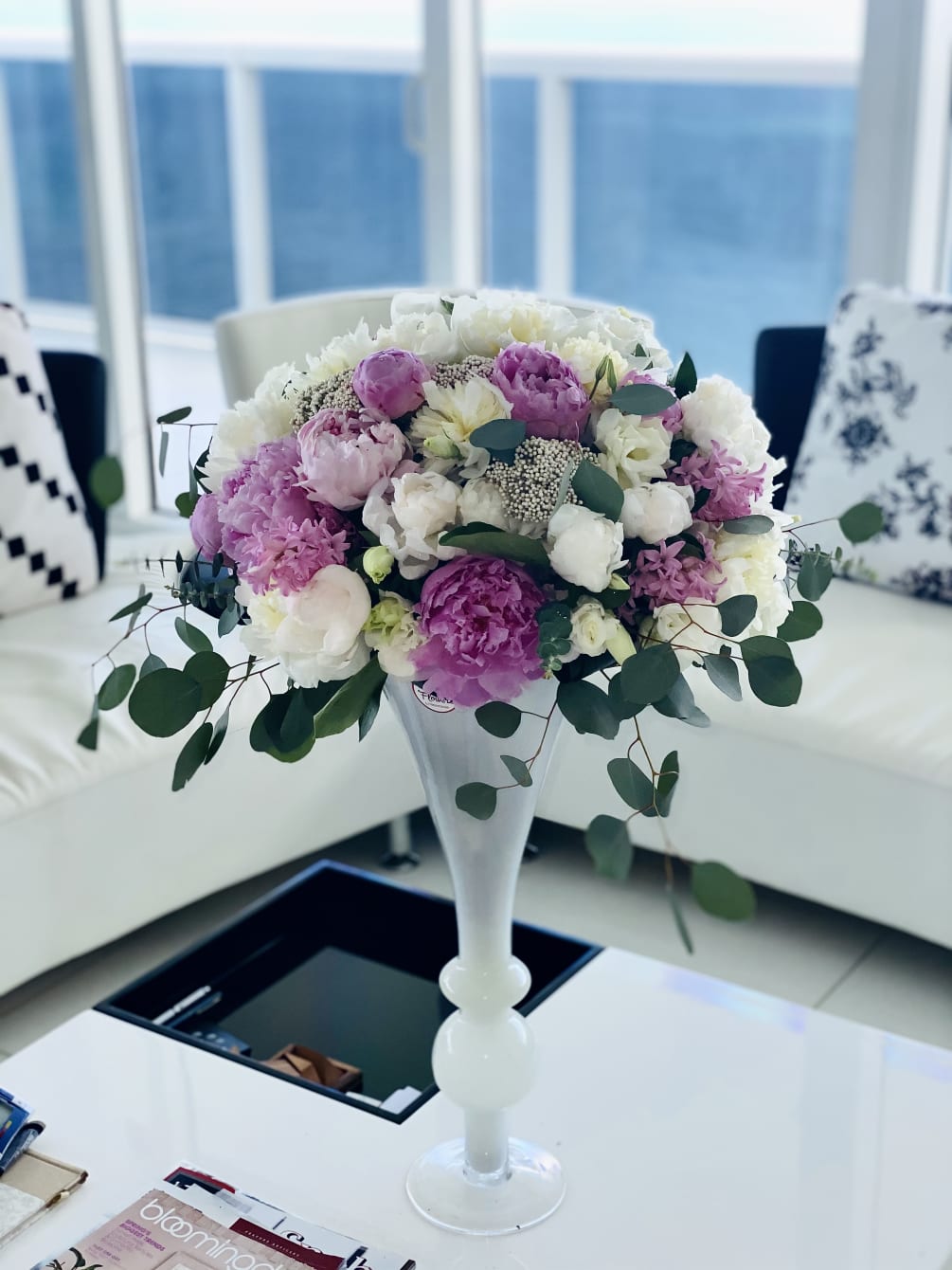 Peonies with lisianthus in a vase . Peony is a symbol of