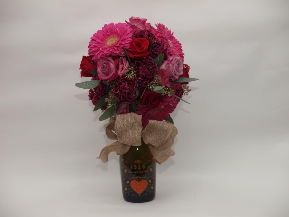 romantic florals  displayed on a bottle of prosecco