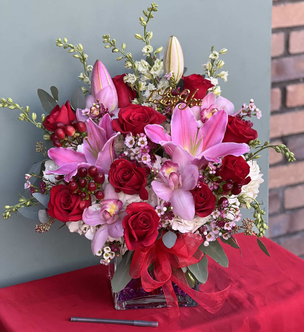 This one of a kind arrangement showcases the color of love, red