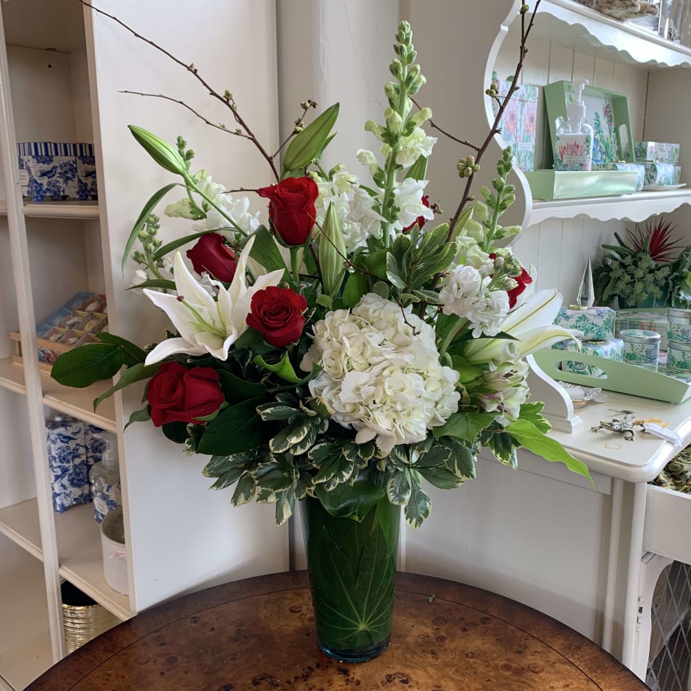 Red roses, white hydrangea, white oriental lilies, white snapdragons, white stock, quice