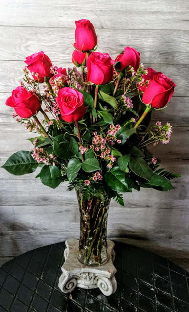 This gorgeous arrangement features one dozen of our fabulous Ecuadorian roses beautifully