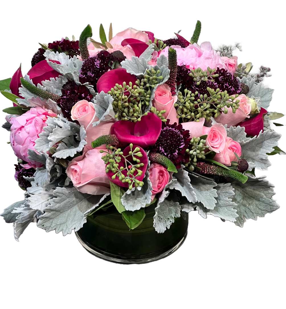 A romantic flower arrangement showcasing various shades of pink is an enchanting