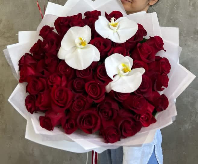 &quot;Love Is&quot; Red Roses and Orchid Bouquet

Our &quot;Love Is&quot; bouquet is a
