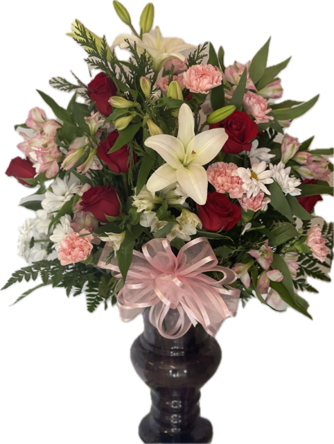 A captivating assortment of mixed florals combined in a captivating vase 