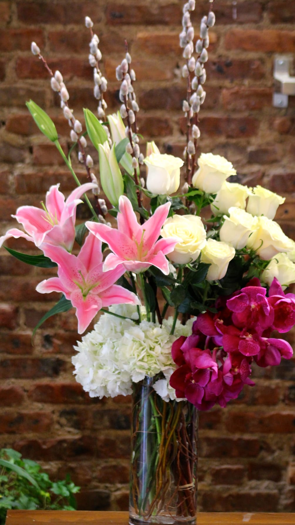 A Modern Styled Arrangement, Designed with Decadent Pink Lilies, Lush White Tibet