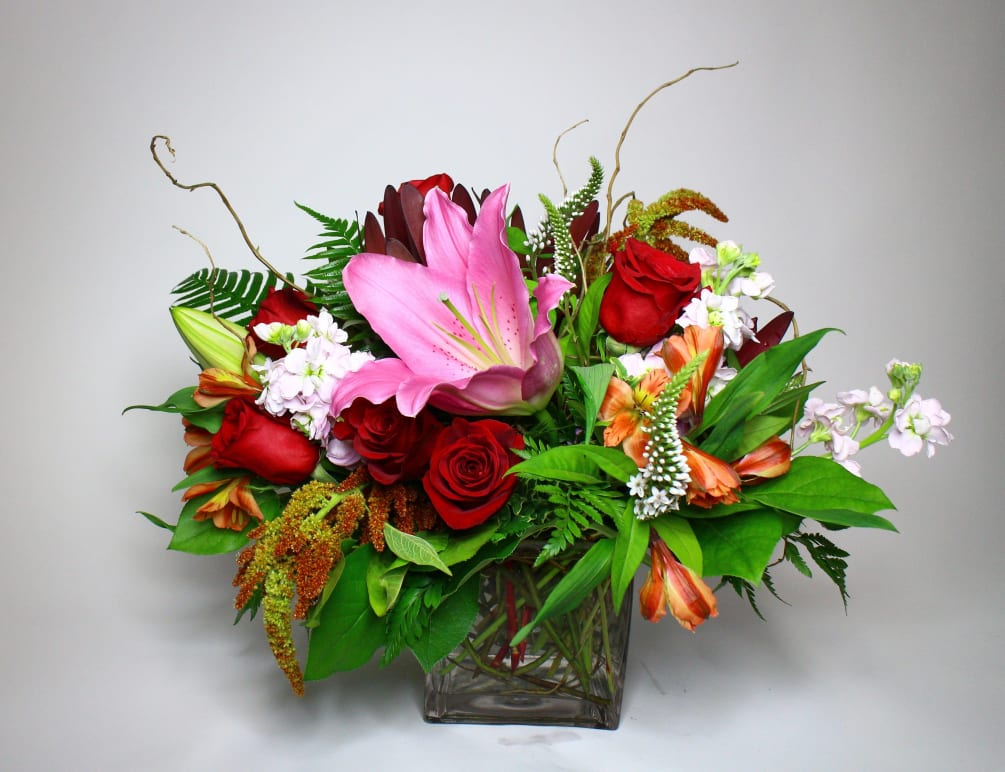 a colorful display of refreshing tones and flowers including lilies, amaranth, and