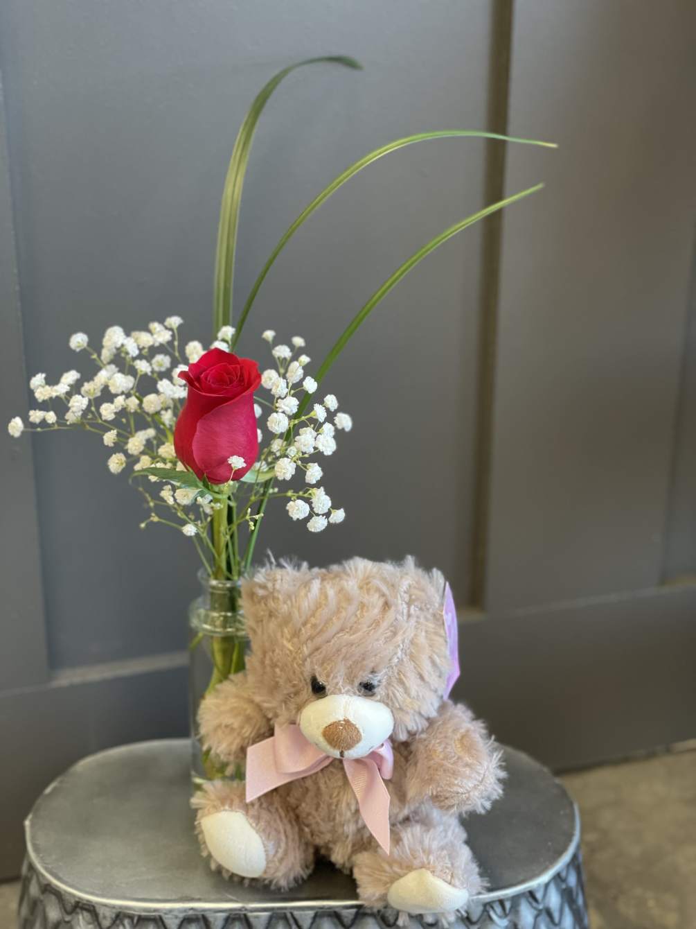 Send a smile and a hug with this adorable arrangement and snuggly