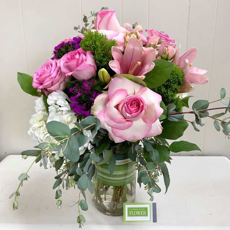 Princess Roses arranged with pink, lavender, white and green blooms will create