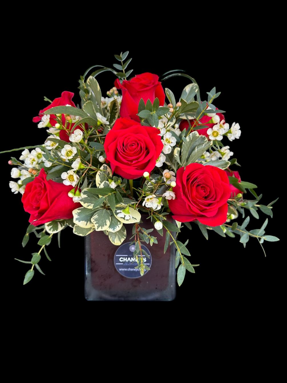 a beautiful arrangement made with a dozen of hand selected red roses.