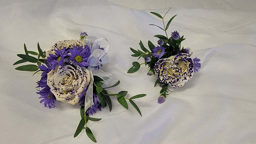Wristlet and Boutonniere set.  Purple glitter spray roses with greenery and