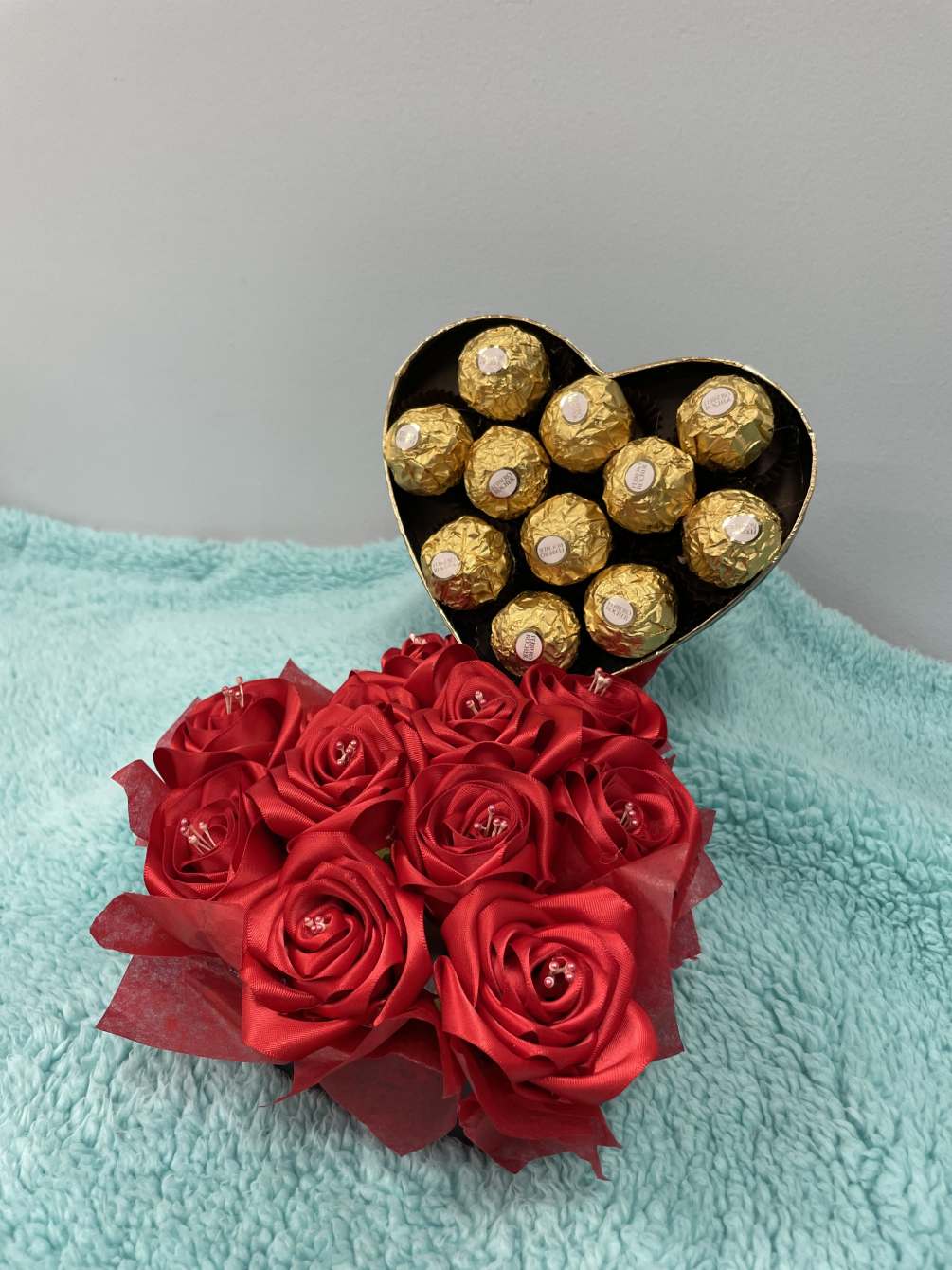 A combination of eternal roses with some chocolate to show your person