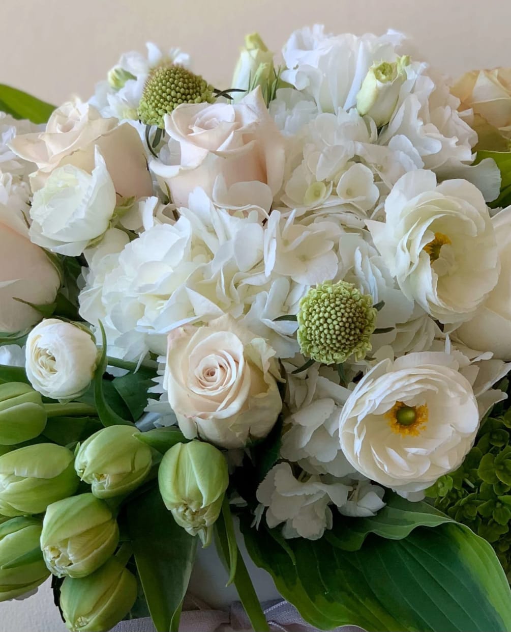We will choose the freshest quality blooms in a neutral color palette.