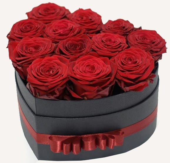 A perfect heart, filled with one dozen red naomi roses.