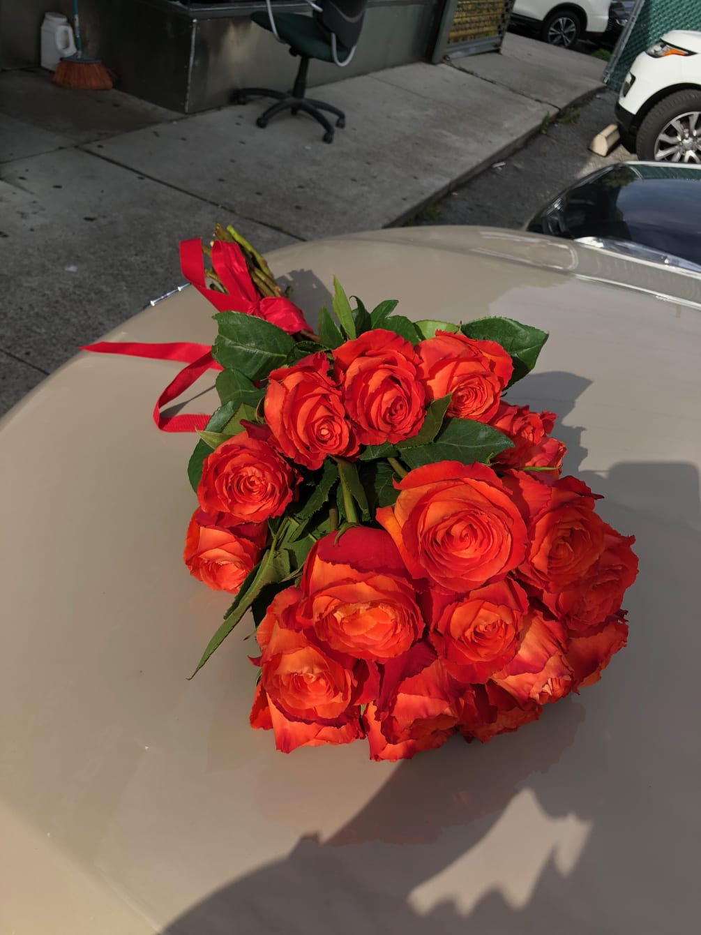 This bouquet has 17 stems of deep orange roses .hand bouquet as