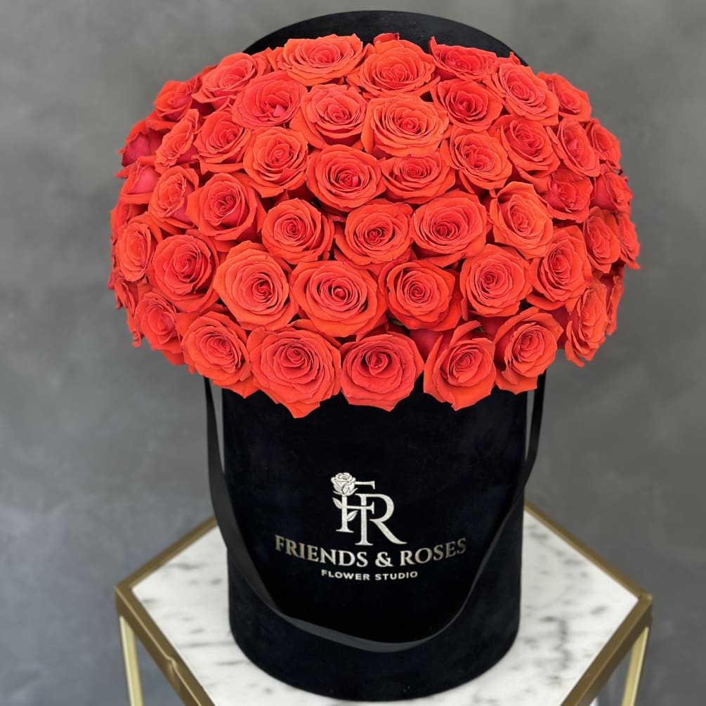 50 coral roses in a black velvet box