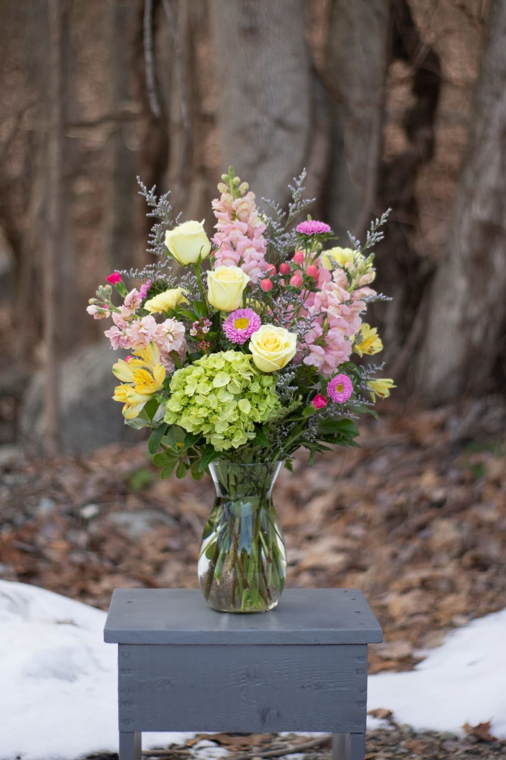 Spring flair arranged in an 8 inch clear glass Jordan vase. Pink
