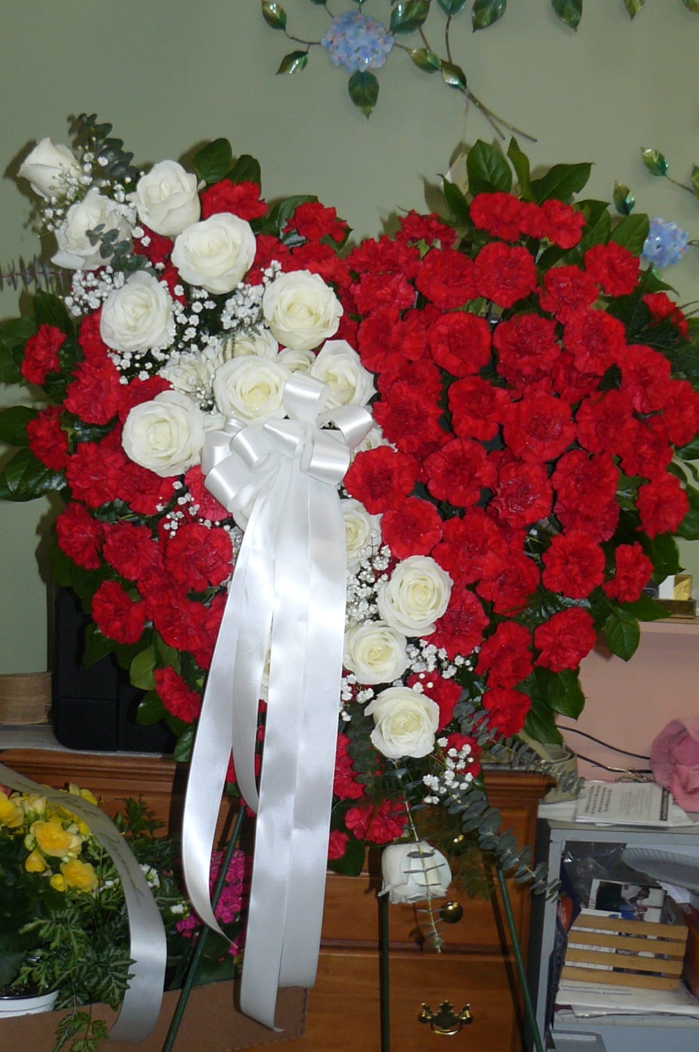 Red Carnations ,Touch of White Roses, Eucalyptus, Assorted Fancy Greens, Babies-Breath, 
