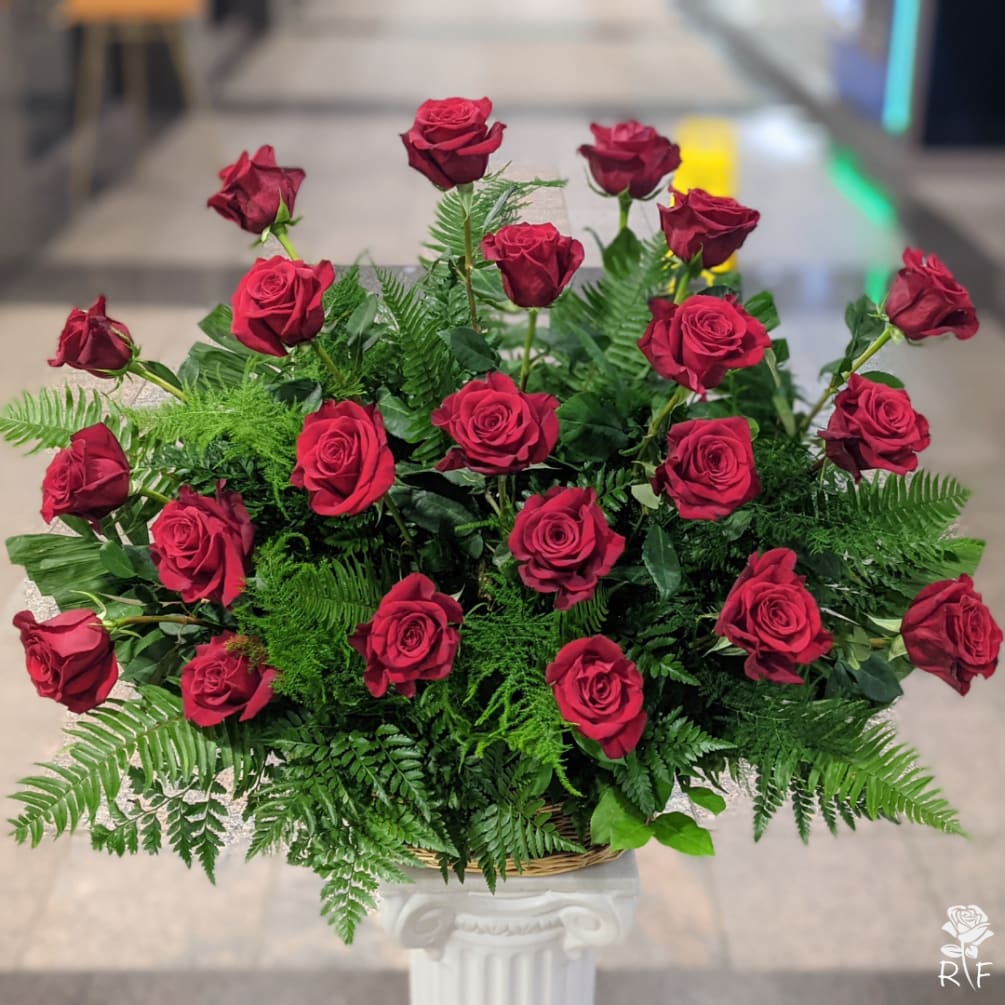 Two dozen (24) premium long stem red roses in a basket. Send