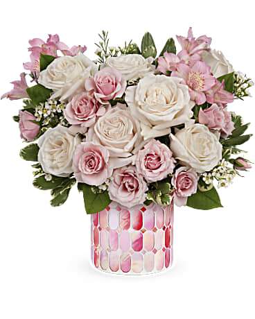 Pink spray roses, white roses, alstroemerias in mosaic container.