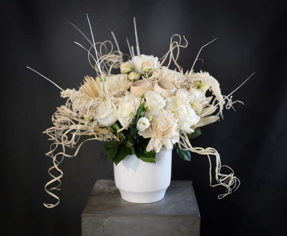 Our White Rose and Dry Floral Arrangement is an elegant and sophisticated