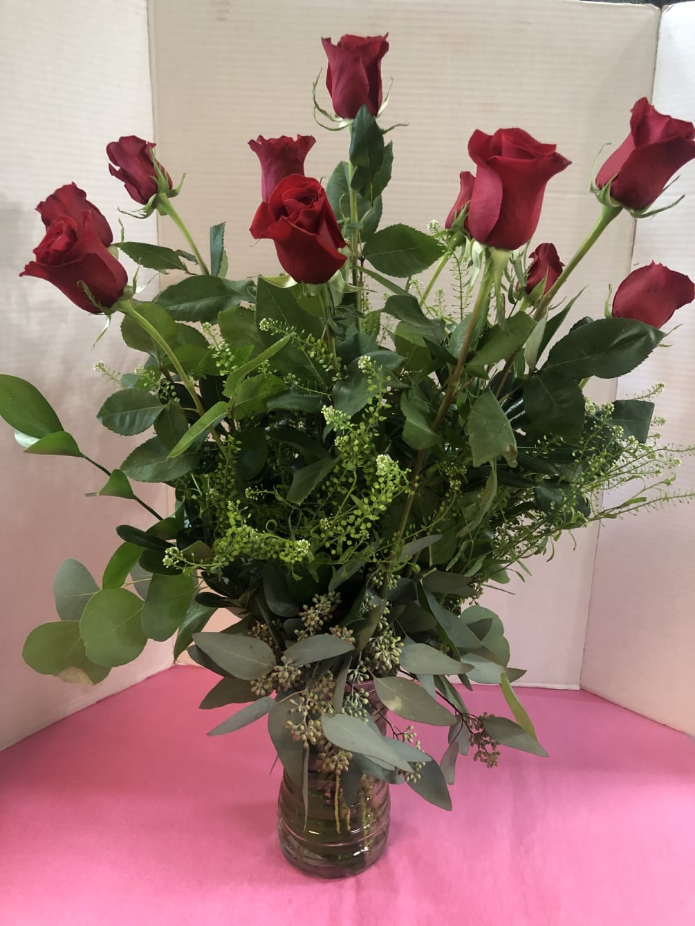 Premium Long Stem Red Roses with Fancy Greens in a Tall Vase.

Call