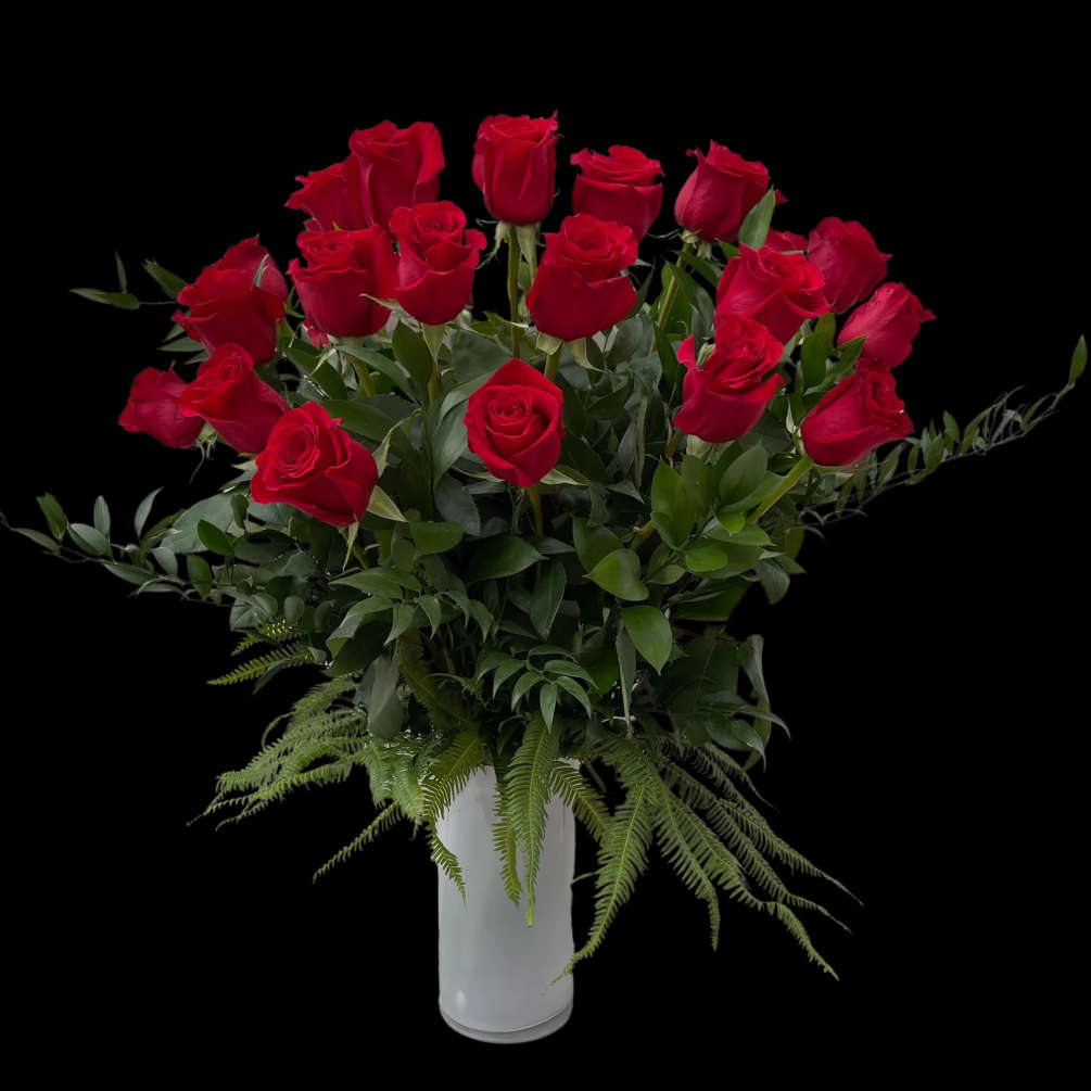 Long Stem Roses, arranged in a white vase accented with luxury foliage
