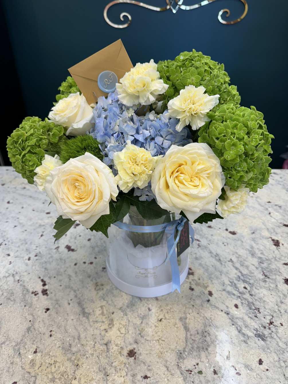Stunning bouquet with fresh Candlelight roses, green and blue hydrangeas, carnations and