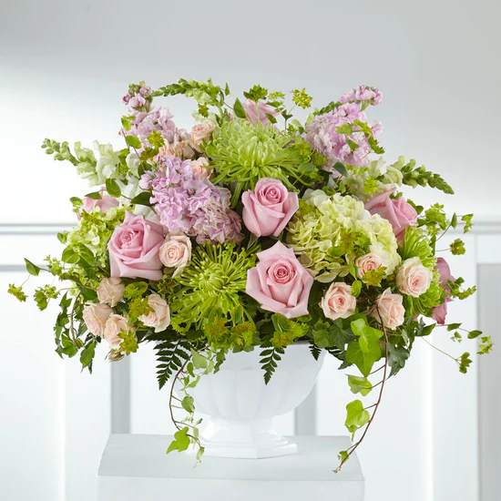 The combination of fresh pink roses and white roses creates a stunning