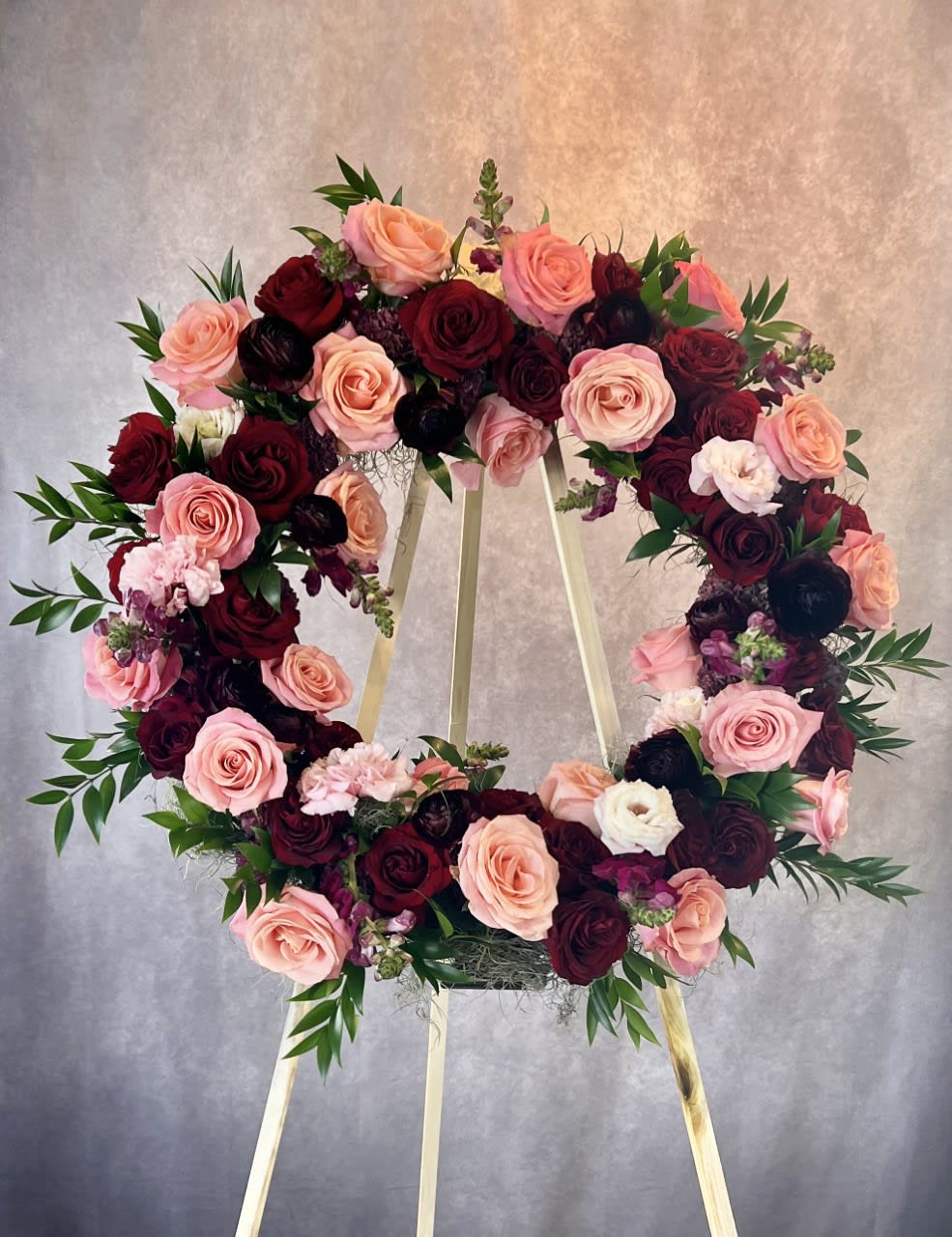 This traditional memorial wreath features the best of the season&rsquo;s offerings in