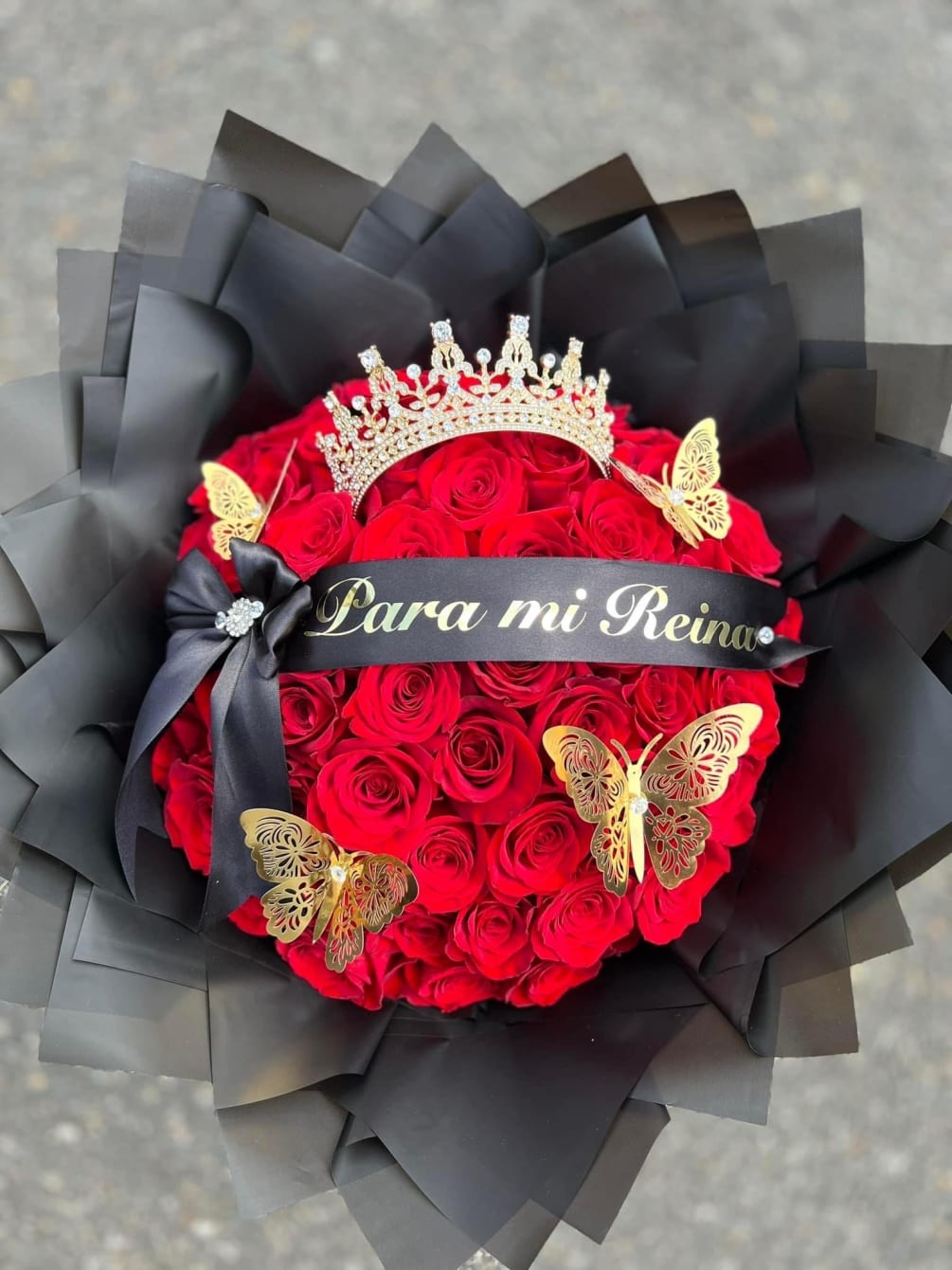 Premium Red Roses  With costumized ribbon and large queen crown. Just