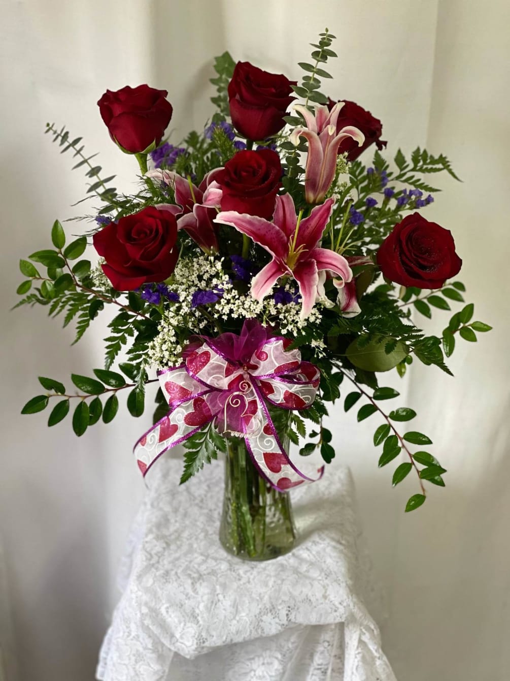 Pink lilies and red roses