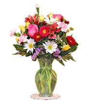 This is an arrangement of mixed seasonal flowers, appropriate for any occasion.