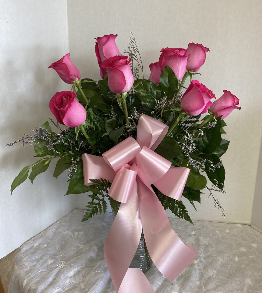 Dozen beautiful pink roses with limonium and a pretty pink bow.
Available today
