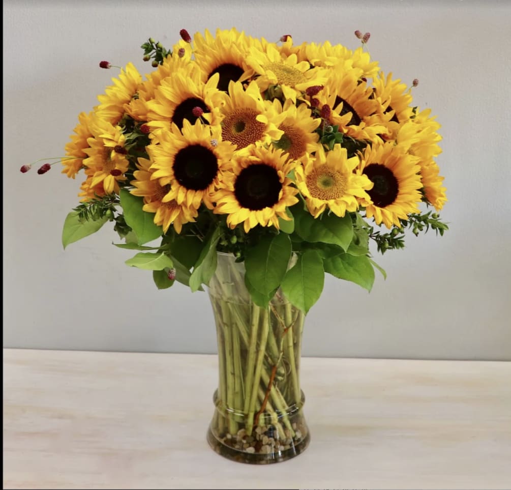 Brighten up anyone&#039;s day with this beautiful arrangement of sunflowers and seasonal
