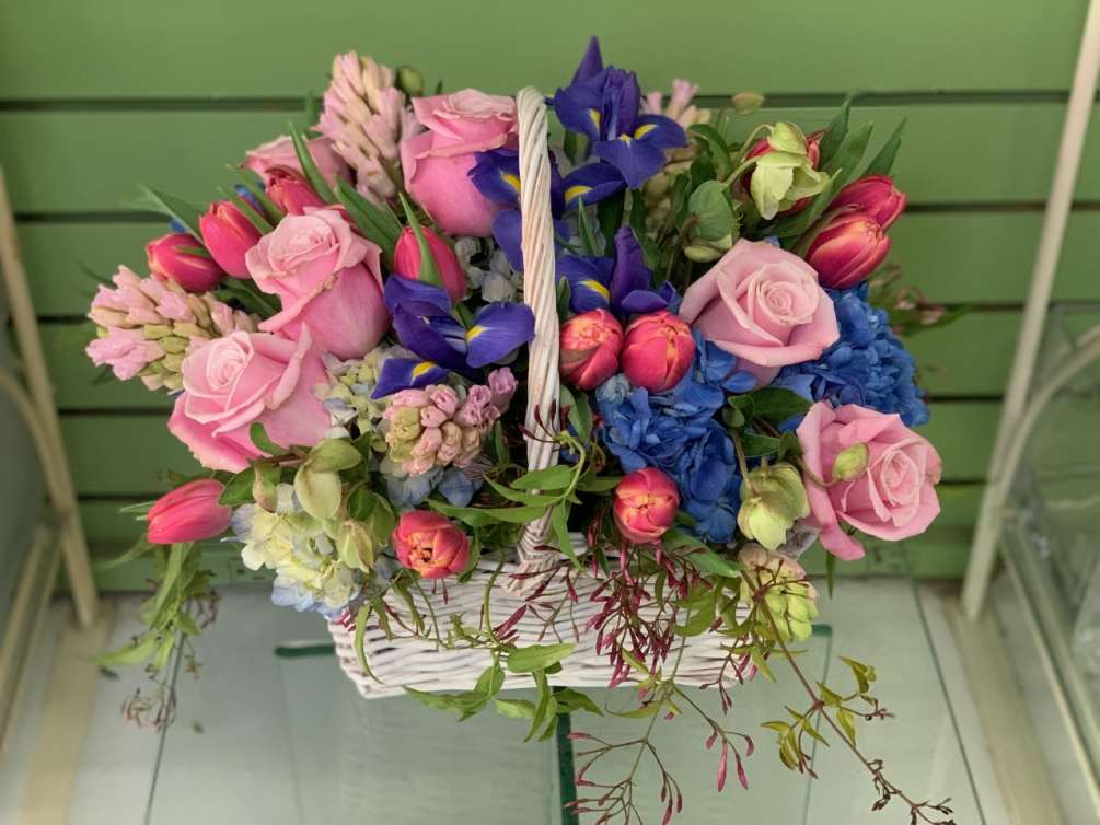 All the best of spring in a classic wicker basket. Tulips, iris