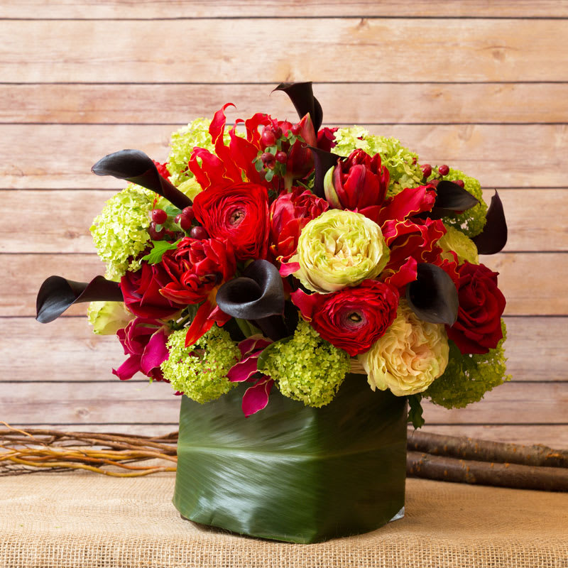 COLORFUL CUBE ARRANGEMENT WITH CALLA LILIES, ROSES, VIBURNUM, GLORIOSA LILIES, RANANCULUS, AND
