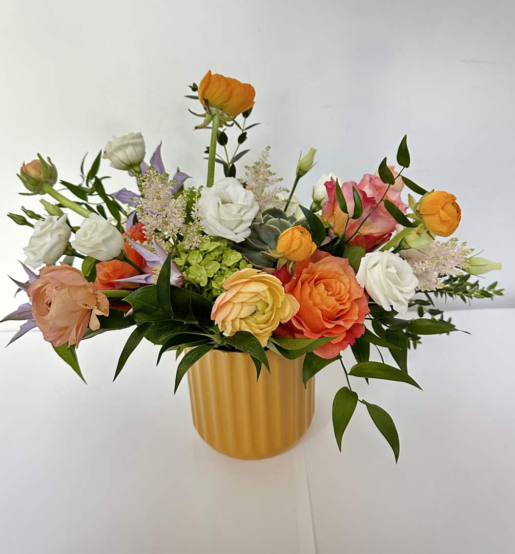 This arrangement features a very bright spring color. It is presented in