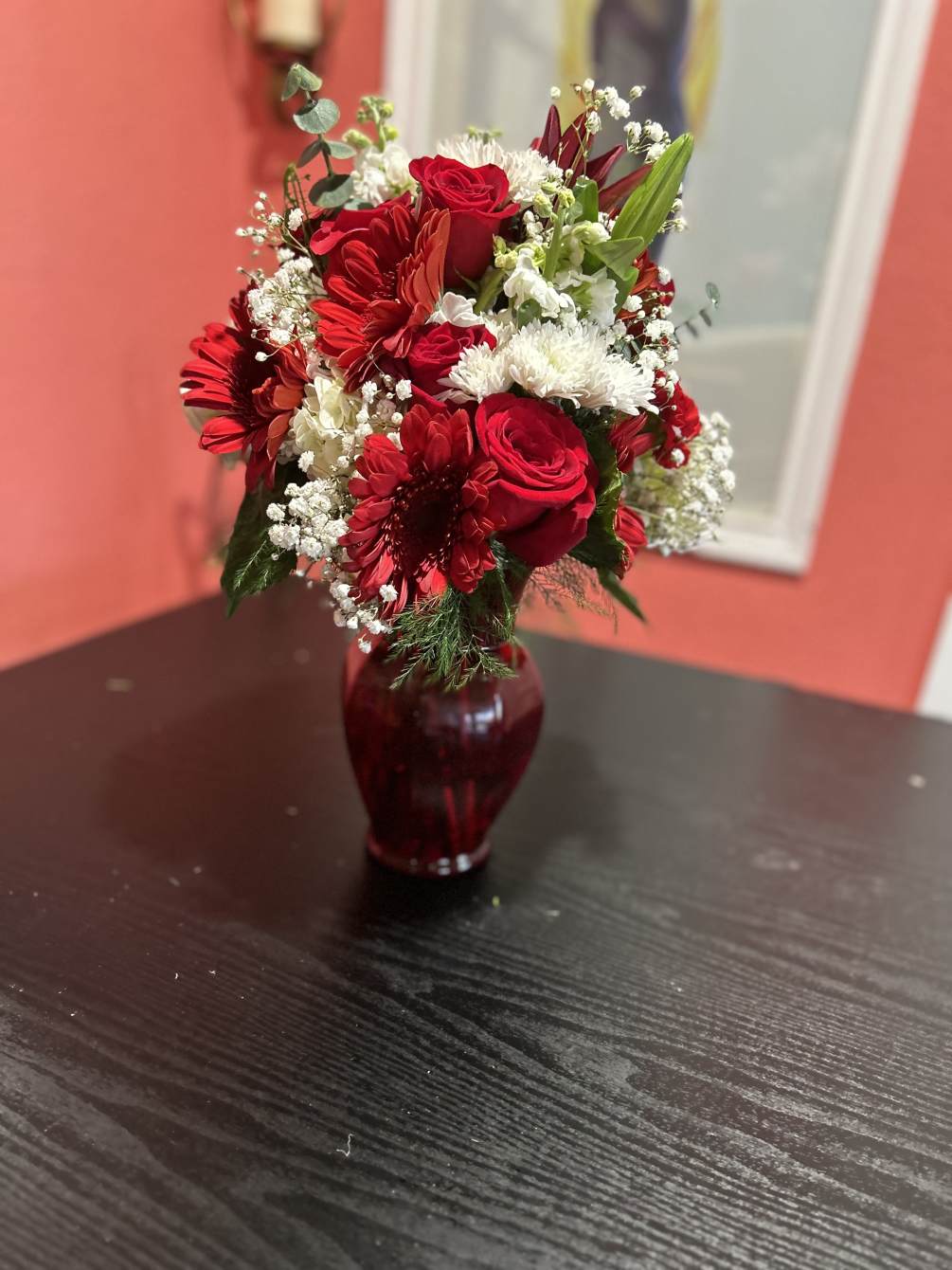 Red and white roses, daisies, stock, and lilies 